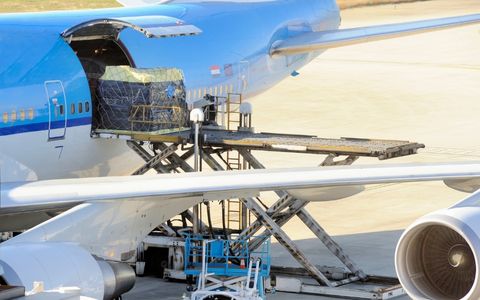 Air freight cargo being loaded onto an airplane